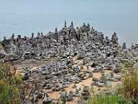 Cairns rock piles on beach 9142
